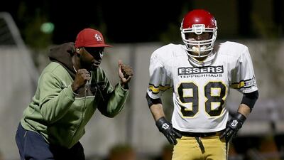 Dubai Stallions coach Andre Sommersell, left, takes a training session at Dubai Sports City ahead of Friday’s game. Satish Kumar / The National