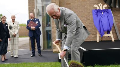 King Charles III cuts into the turf at the Whittle Laboratory extension in Cambridge. AP