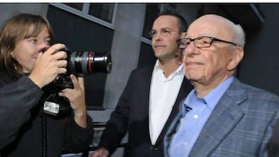 Rupert Murdoch, right, the chairman of News Corporation, walks to his flat with his son James Murdoch, the chief executive of News Corporation for Europe and Asia, in London last Sunday - the day their News of the World published its final edition because of the phone hacking scandal. Facundo Arrizabalaga / EPA