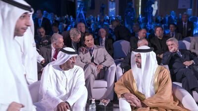 Sheikh Ahmed bin Saeed, left, the Emirates Group chairman and the president of Dubai Civil Aviation Authority, speaks yesterday with Sheikh Hamed bin Zayed, head of the Crown Prince Court Abu Dhabi, before the opening of the Global Aerospace Summit in Abu Dhabi. Silvia Razgova / The National