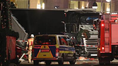 A fireman stands near a black lorry that ploughed through a Christmas market on December 19 in Berlin, Germany. At least 12 people died and Berlin’s police force said Tuesday it was treating the crash as “a probable terrorist attack”. Sean Gallup / Getty Images