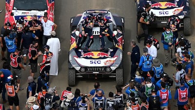Mini's Stephane Peterhansel and his co-driver Edouard Boulanger, both of France, celebrate after winning the Dakar Rally, on Friday, January 15. AFP
