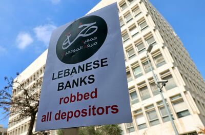 Bank customers rally in the streets of Beirut, after their deposits were blocked. AFP