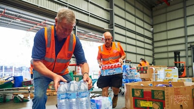 Volunteers help help organise large donations of goods at the Food Bank Distribution Centre bound for areas impacted by bushfires in the Glendenning suburb of Sydney, Australia. Getty Images