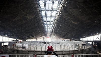 An attendee takes a photograph of a terminal building at Beijing's new international airport in China. Giulia Marchi / Bloomberg