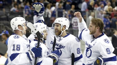The Tampa Bay Lightning celebrate their 2-0 win over the New York Rangers in Game 7 of the Eastern Conference final during the NHL Stanley Cup playoffs, Friday, May 29, 2015, in New York. (AP Photo/Frank Franklin)