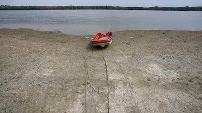 A boat on a bank of the receding Danube river, after a lengthy drought near the village of Cortanovci, Serbia. AP