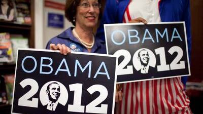 A US citizen holds a pro-Obama sign minutes after his victory was announced, in Jerusalem, Israel. Abir Sultan / EPA