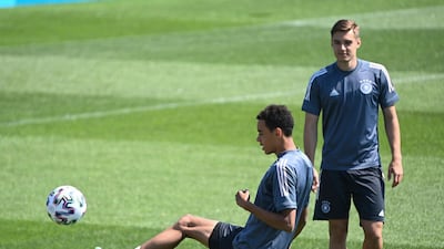 Germany's Jamal Musiala left, and teammate Florian Neuhaus at training on Monday, June 28. AP