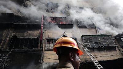 Firefighters work to quell a huge fire that broke out at Bagri market in Kolkata, India. EPA