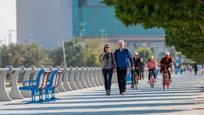 Residents take a walk on Abu Dhabi Corniche. Expatriates have been called upon to ill out a questionnaire designed by the Department of Community Development. Vicor Besa / The National