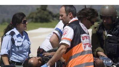 A pro-Palestinian activist is evacuated to Hadassah Ein Kerem Hospital in Jerusalem after Israeli navy seals stormed a boat carrying humanitarian aid to the Gaza Strip against an Israeli blockade, in a raid which killed at least 10 passengers.