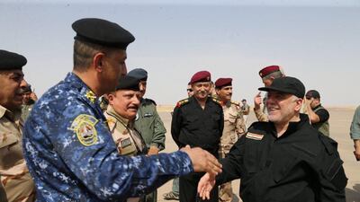 Iraqi Prime Minister Haider al-Abadi (R) is pictured in Mosul Iraq, July 9, 2017. Iraqi Prime Minister Media Office/Handout via REUTERS ATTENTION EDITORS - THIS IMAGE WAS PROVIDED BY A THIRD PARTY. NO RESALES. NO ARCHIVES. TPX IMAGES OF THE DAY