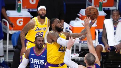 Los Angeles Lakers forward LeBron James (23) shoots against LA Clippers forward Patrick Patterson (54) and centre Ivica Zubac (40).USA Today
