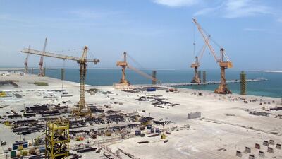 Cranes stand at a massive drydock and ship repair facility in Oman's Duqm Special Economic Zone. Fatma Alarimi / Reuters