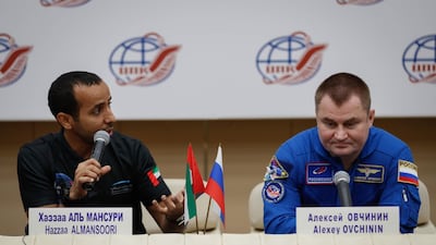 Emirati astronaut Hazza Al Mansouri and Russian cosmonaut Alexey Ovchinin attend a news conference at the Gagarin Cosmonaut Training Centre in Star City outside Moscow, Russia, on Wednesday. Yuri Kochetkov / EPA