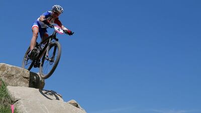 Julie Bresset, of France, competes on her way to win the gold medal in the Mountain Bike Cycling women's race at Hadleigh Farm. Christophe Ena/AP Photo