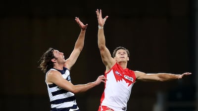 Jack Henry, of the Geelong Cats, competes for the ball against Sydney Swans' Callum Sinclair during the AFL match at Sydney Cricket Ground on Saturday, May 1. Getty