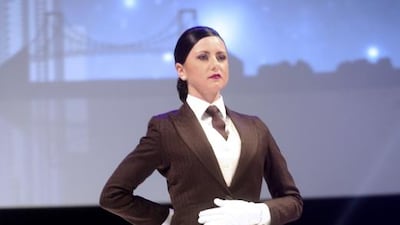 A member of Etihad's cabin crew shows off their butler uniform. Etihad offers a butler service aboard its new A380. Courtesy Etihad