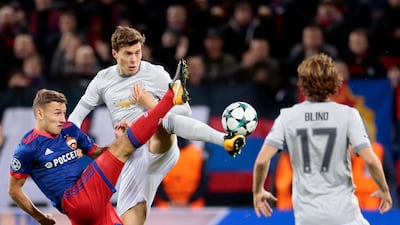 Manchester United's Victor Lindelof challenges CSKA's Fedor Chalov. Ivan Sekretarev / AP Photo