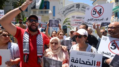 Hundreds of Tunisians marched through Tunis chanting as they protested against a spate of arrests under a presidential decree that critics say is being used to stifle dissent. AFP