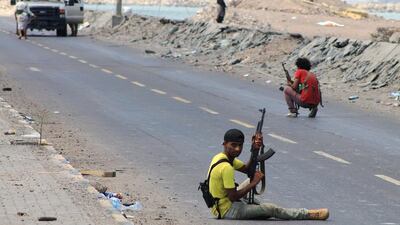 Armed tribal supporters of Yemen's exiled president, Abdrabu Mansur Hadi, keep position near Aden's international airport, as battles against Shiite Houthi rebels continue, on May 2, 2015. Saleh Al-Obeidi/AFP Photo