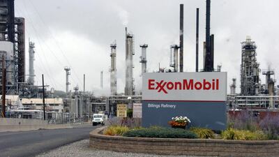 ExxonMobil, Chevron and others may see their ratings cut. Matthew Brown / AP