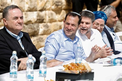 From left: Israeli Defence Minister Israel Katz, Yossi Dagan, head of the Shomron Regional Council, and Israel's far-right Finance Minister Bezalel attend the resettlement ceremony of Sa-Nur in the Israeli-occupied West Bank on April 19, 2026. AFP