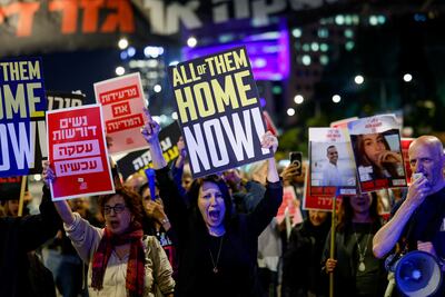 People attend a demonstration calling for the return of hostages held in Gaza since October 7. Reuters