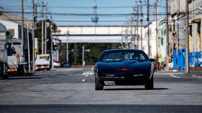 Masamune Isogai driving a 1991 Trans Am Knight Rider in Urayasu, an eastern suburb of Tokyo. AFP