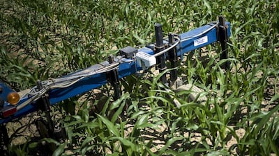 A sensor is seen attached to a tractor drawn liquid fertiliser applicator at the Little Bohemia Creek farm in Warwick, Maryland. Technologies such as GPS and auto-steering have become the norm in mechanized farming in the United States and other countries. Brendan Smialowski / AFP