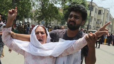 A mother mourns the death of her son outside a hospital in Lahore, Pakistan. A suicide bomber attacked security forces guarding a famous Sufi shrine in Pakistan's eastern city of Lahore, police said. AP Photo