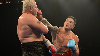 Sonny Bill Williams, right, strikes South African opponent Francois Botha during their World Boxing Association (WBA) heavyweight fight in February 2013. EPA
