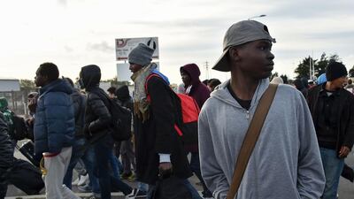 Young migrants at the Jungle camp in Calais on October 27, 2016, during a massive operation to clear the squalid settlement that is believed to have housed up to 8,000 people including more than 1,000 children. Philippe Huguen / AFP