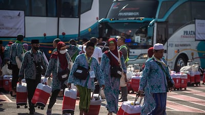 Pilgrims board a plane at the Juanda International Airport in Sidoarjo. AFP