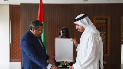 Sheikh Abdullah bin Zayed presents TP Seetharam the Independence Order. Wamا