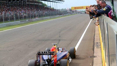 Daniel Ricciardo of Red Bull Racing drive past his teammates after winning the Hungarian Grand Prix on Sunday. Mark Thompson / Getty Images / July 27, 2014