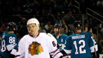 When the San Jose Sharks are winning, Joe Thornton, centre (No 19), is all smiles. But it is when things are not going well that he can be too critical because, Sharks coach Doug Wilson says, Thornton cares too much, so much so that even Wilson has come under his line of fire. Ezra Shaw / AFP