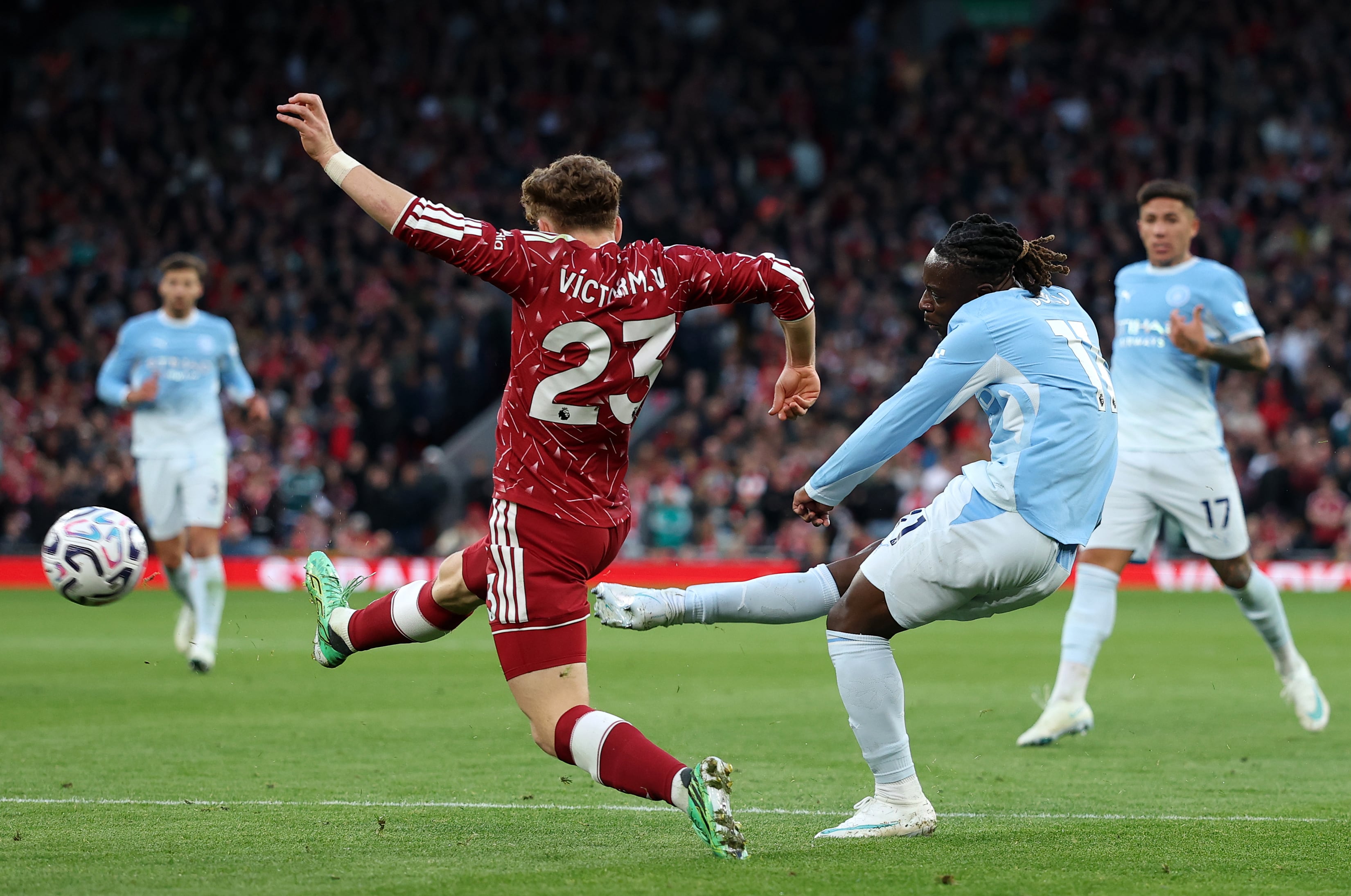 Jeremy Doku curls home a superb second goal for Manchester City. Getty Images
