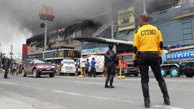 A view of a burning shopping mall in Davao city, southern Philippines, on December 23, 2017. The photo was issued on December 24. Ruby Embrano / EPA
