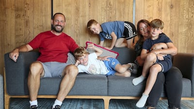 David Howell, an English professional golfer, with his wife Emily and sons Freddie, Sam and Charlie at the Zabeel House. The family has extended their stay in the UAE because of the lockdown. Pawan Singh / The National