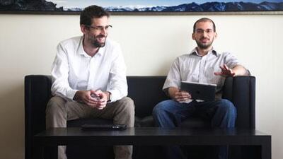 Hungarians Peter Saghegyi, left, and Attila Maldrik are two of the team that developed a new iPhone app game, which incorporates a puzzle that is set in and around Dubai. Lee Hoagland / The National