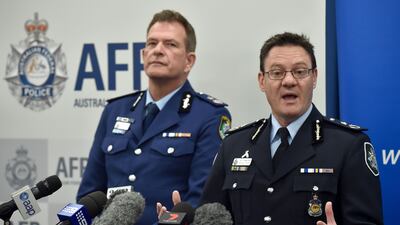 Michael Phelan, right, Australia's Federal Police Deputy Commissioner speaks to the media with New South Wales Police deputy commissioner David Hudson in Sydney. A senior ISIL commander directed a group of Australian men to carry out a terror attack on a flight out of Sydney. Peter Parks / AFP Photo