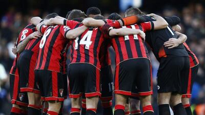 Bournemouth players in a huddle ahead of kick-off. Peter Nicholls / Reuters