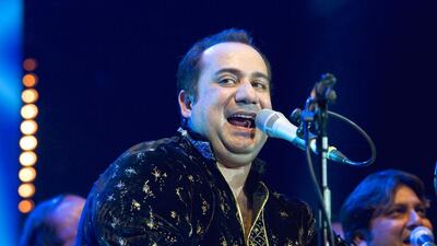 LONDON, UNITED KINGDOM - AUGUST 25: Rahat Fateh Ali Khan performs on stage at O2 Arena on August 25, 2013 in London, England. (Photo by Robin Little/Redferns via Getty Images)