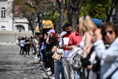 People queue at a bus stop at Rossio square, after the Lisbon subway stopped working during a massive power cut. AFP