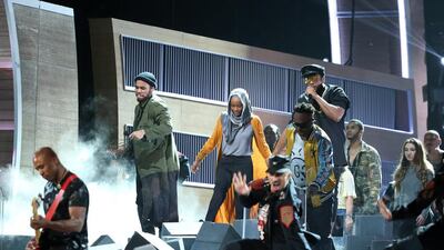 A Tribe Called Quest and Anderson Paak break down a wall during their performance at the 59th Annual Grammy Awards. Lucy Nicholson / Reuters