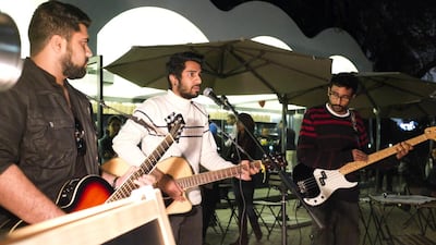 The band Physical Graffiti plays at a Freshly Ground Sounds acoustic night held at The Archive in Safa Park. Razan Alzayani / The National