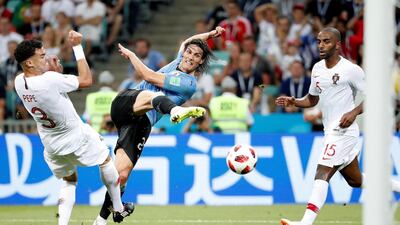 Edinson Cavani of Uruguay and Pepe of Portugal in action during the round of 16 soccer match between Uruguay and Portugal. Juan Herrero / EPA