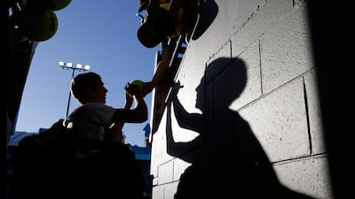 Russia's Andrey Kuznetsov signs autographs after winning his first round match against Argentina's Juan Monaco at the Australian Open. Andy Wong / AP Photo